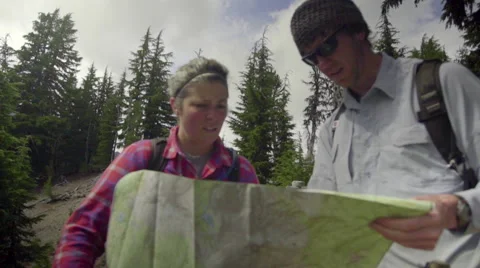 Close up of hikers looking at a map Stock Footage 59066185