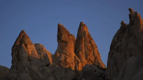 Close-up of hills. One part is in the shade, other in the warm light of sunset. Stock Footage 105190180
