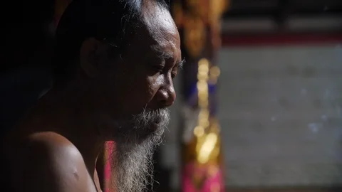 Close up of hindu high priest preparing for Melukat Mebayuh Ceremonial, Bali Stock Footage 140295773
