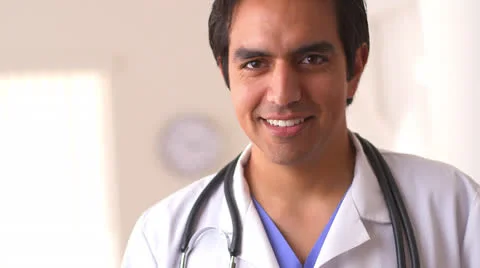 Close up of Hispanic doctor smiling 库存影片 26153647