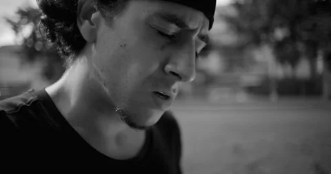 Close-up Hispanic man showing visible frustration and anger, expression filled w Stock Footage 320063441