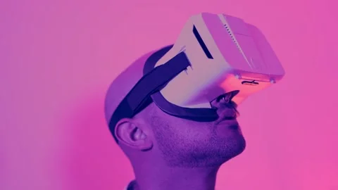 Close up of a hispanic man using virtual reality goggles Stock Footage 241721970