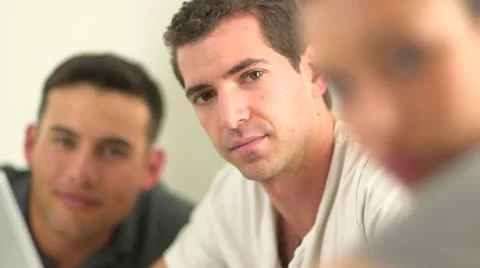 Close up of Hispanic office worker with team mates Video stock 22358864