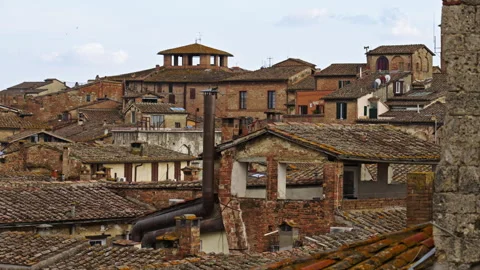 Close-Up of Historic Rooftops and Old Brick Buildings Stock Footage 256033454