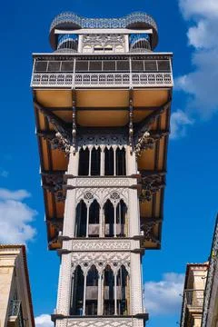 Close-up of historic Santa Justa elevator under blue sky, Lisbon, Portugal Фото