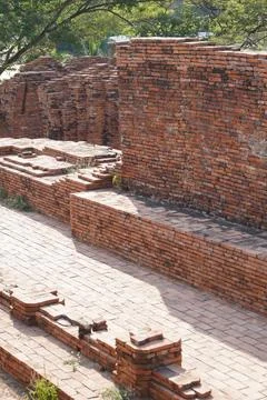 Close-up of historical archaeological site featuring weathered orange brickwork  Stock Photos
