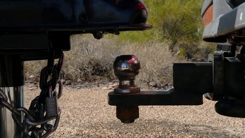 Close up of hitching up a recreational vehicle trailer Stock Footage
