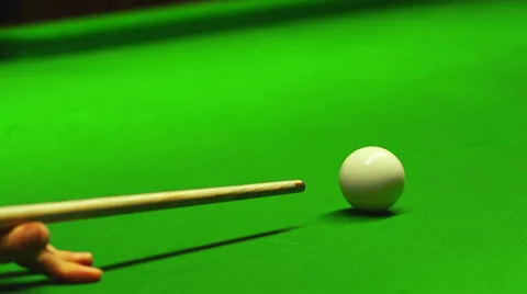 A close up of hitting a cue ball on a green billiard table Stock Footage 33847980