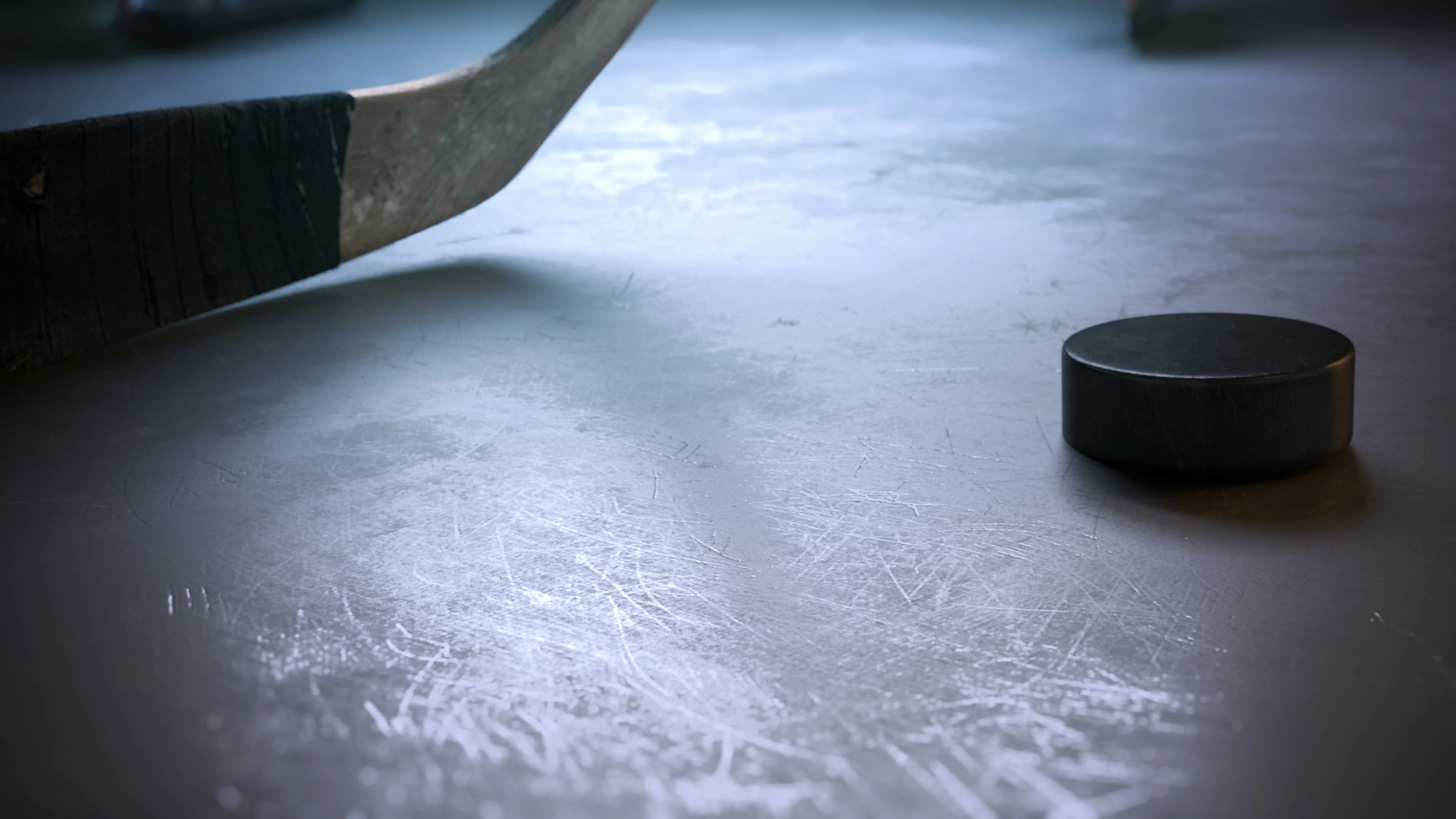 hockey puck sliding on ice
