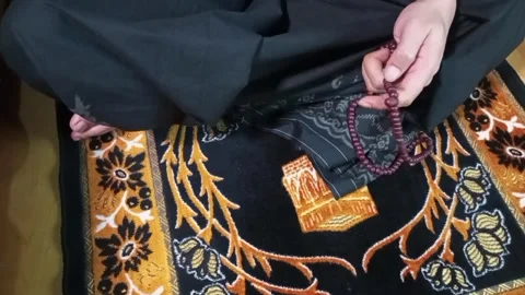 Close up holding prayer beads Stock Footage 309284206