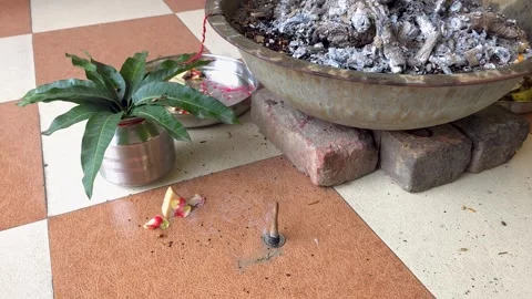 Close up of holy fire pit and sacred plant pot on tile floor detailed view Видео 347256791