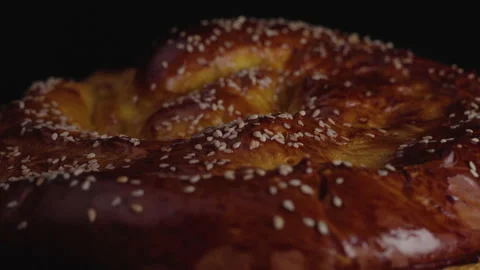 Close-up, Home Fresh Bread Spins on The Turning Table on The Black Face Stock Footage 147894406