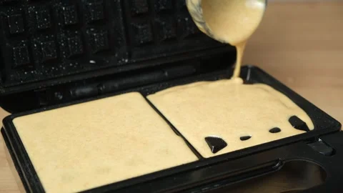 Close-up of Homemade Dough Being Added to a Waffle Iron for Baking. Stock Footage 324457563
