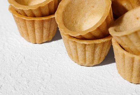 Close-up of homemade empty tartlets baskets of puff pastry Stock Photos