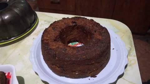 Close-up of homemade pudding cake on kitchen table in 4K Stock Footage 155302122