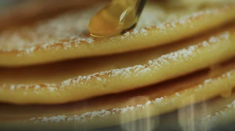 Close up, Honey dripping down a pancake stack Stock Footage 51763725