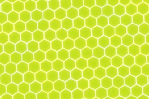 Close-up of honeycomb pattern with yellow hexagons Illustrazione stock