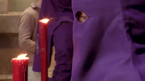 Close Up of Hooded Penitent With Candle During Semana Santa Stock Footage 335942541