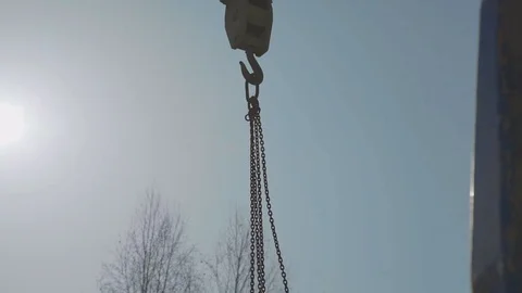 Close-up of the hook of a crane against the blue sky. Crane transport Video stock 73730820