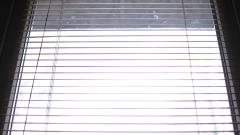 Close up on horizontal blinds hanging on the window Stock Footage 258367924