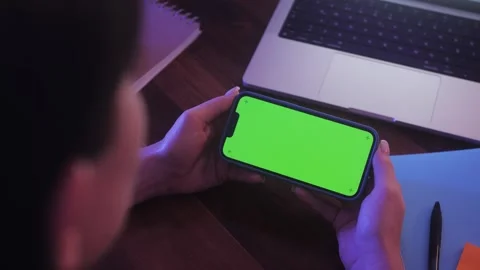 Close up Horizontal hands holding smartphone with green screen. Green screen Stock Footage 264946911