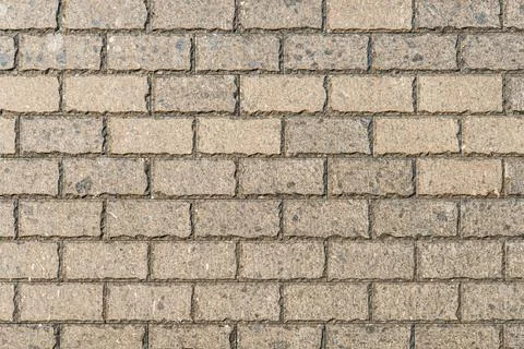 Close-up of a horizontal, light brown brick wall section, uniform bricks, n.. Stock Photos