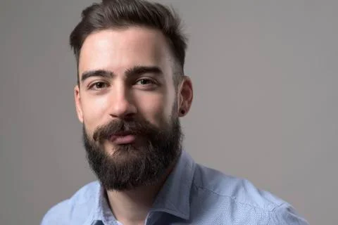 Close up horizontal portrait of stubble bearded smart casual business man wit Stock Photos