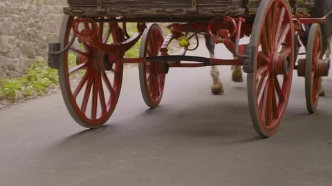 Close up of horse drawn wagon as it passes Stock Footage
