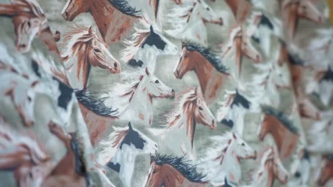 Close-up of horse pattern fabric with wild mustangs moving slowly Stock Footage 338444274