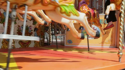 Close up of horses on fairground carousel outside Funland at Southport pier Stock Footage 44791970