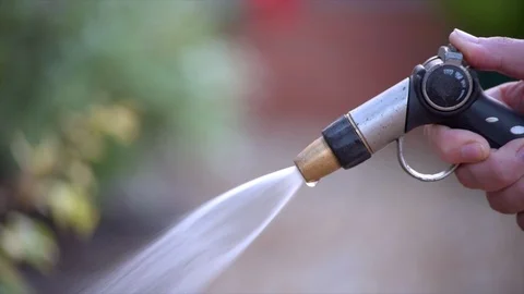 Close Up of a Hosepipe Turning Off Stock Footage 93256860
