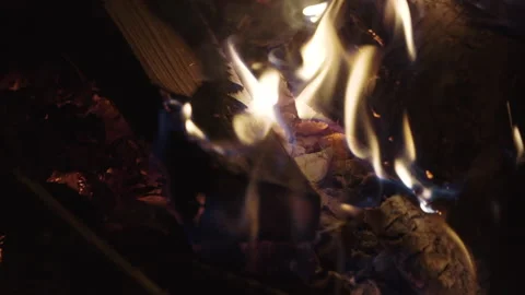 A close up of hot charcoal burning in a grill in slow motion and flames Stock Footage 219464465