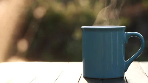 Close up hot coffee cup or tea with steaming smoke. Stock Footage 152494924