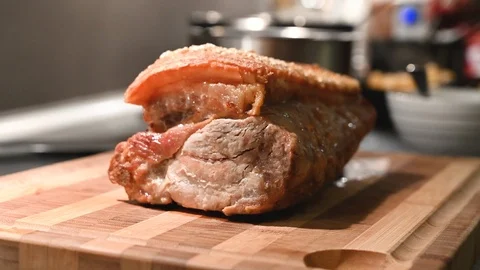 Close up of hot crispy roast pork placed on a cutting board Stock Footage 116230149