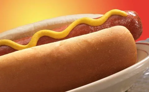 Close-up of a hot dog with yellow mustard Stock Photos