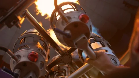 Close-up of a hot flame torch during balloon inflation Stock Footage 105123703