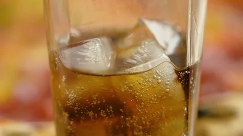 Close-up, hot fresh pepperoni pizza and a glass of cola with ice cubes. Stock Footage 246712338