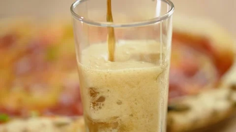 Close-up, hot fresh pepperoni pizza and a glass of cola with ice cubes. Stock Footage 246712345
