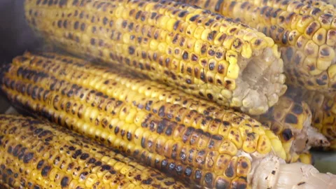 Close-up hot fried corn with smoke over it. Stock Footage 88549672