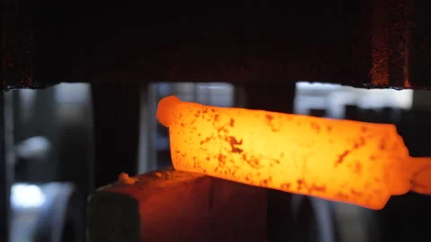 Close-up of hot iron under mechanical hammer in slow motion Video stock 205485689