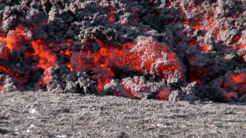 Close up of hot lava flowing from a volcano in Iceland Stock Footage 330267769