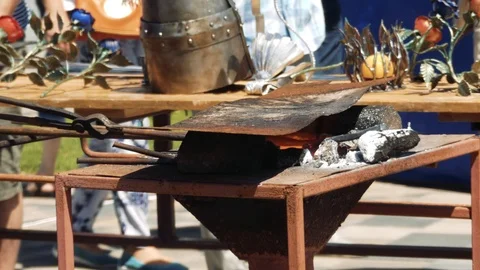 Close Up of Hot Metal Bar Being Heated in a Coal Forge in the Blacksmith Shop 動画素材 110836857