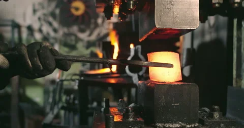 A close-up of the hot metal being squeezed by the press Video stock 165447526