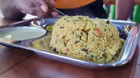 A close-up of hot methi pulao or fenugreek rice served on a plate Stock Footage 232713877