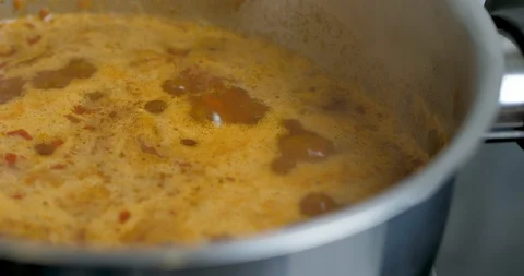 Close- up. Hot Pepper Chilli Sauce Is Heated And Boiled In A Pan. Tomato Sauce Stock Footage 128096252