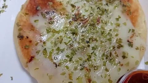 Close-up of Hot Pizza Slice with Melting Mozzarella Cheese Pull Stock Footage 332175996