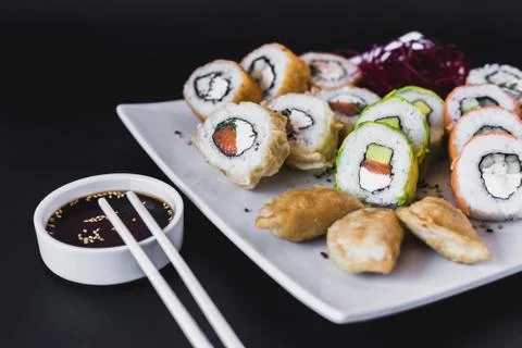 Close up Hot sushi rolls table with gyoza Stock Photos
