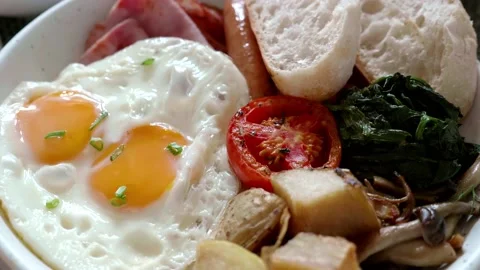 Close-up of Hotel Breakfast with Fried Eggs, Grilled Tomato and Mushrooms Stock Footage 159736593
