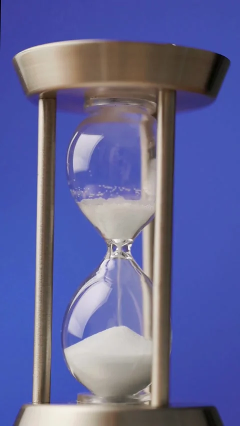 Close-up of Hourglass with Sand Falling Stock Footage 339161219