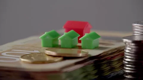 Close-Up House On Canadian Cash Stack - Real Estate Investment Idea Stock Footage 309680844